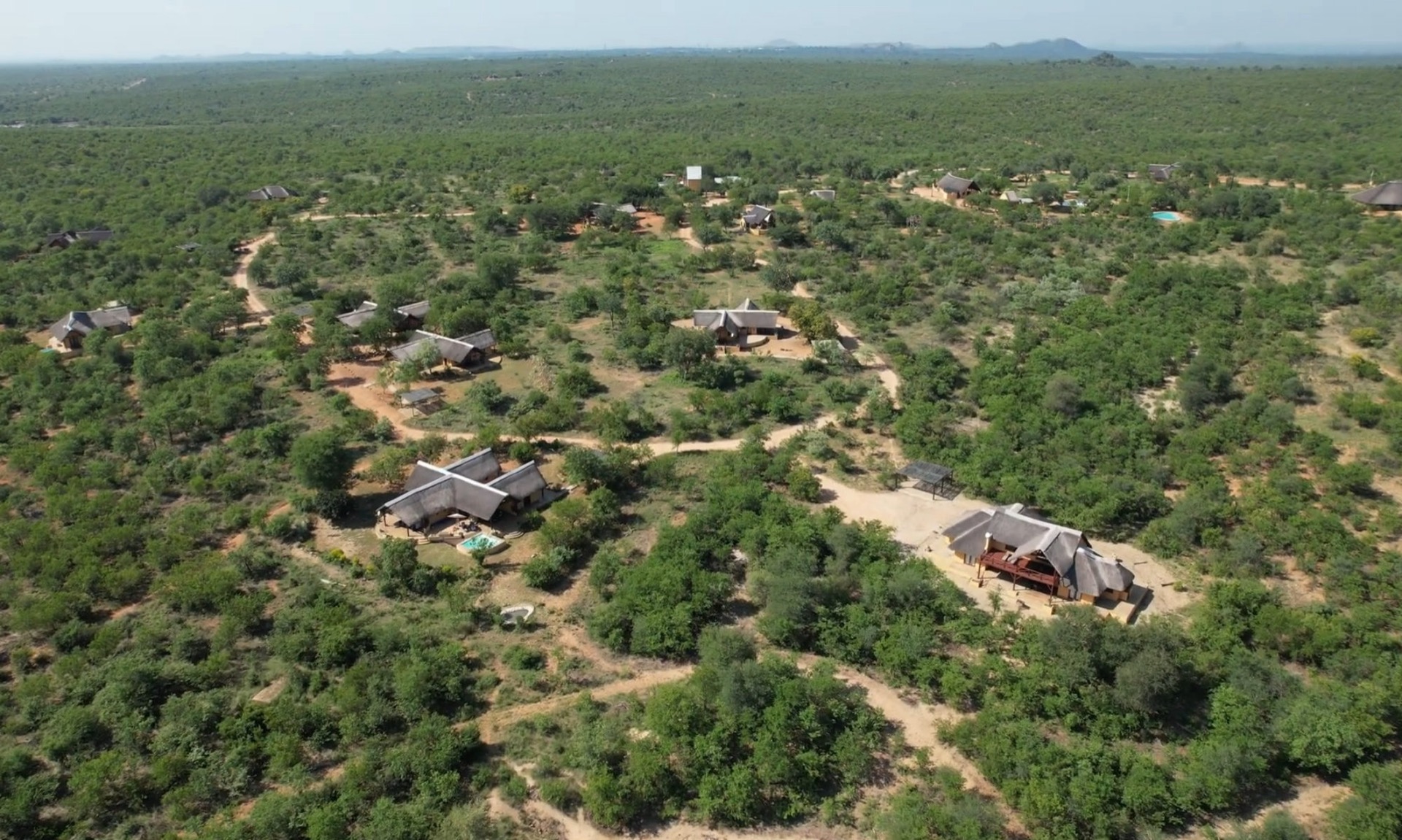 Aerial view of the Silonque estate's scattered homes in open bush