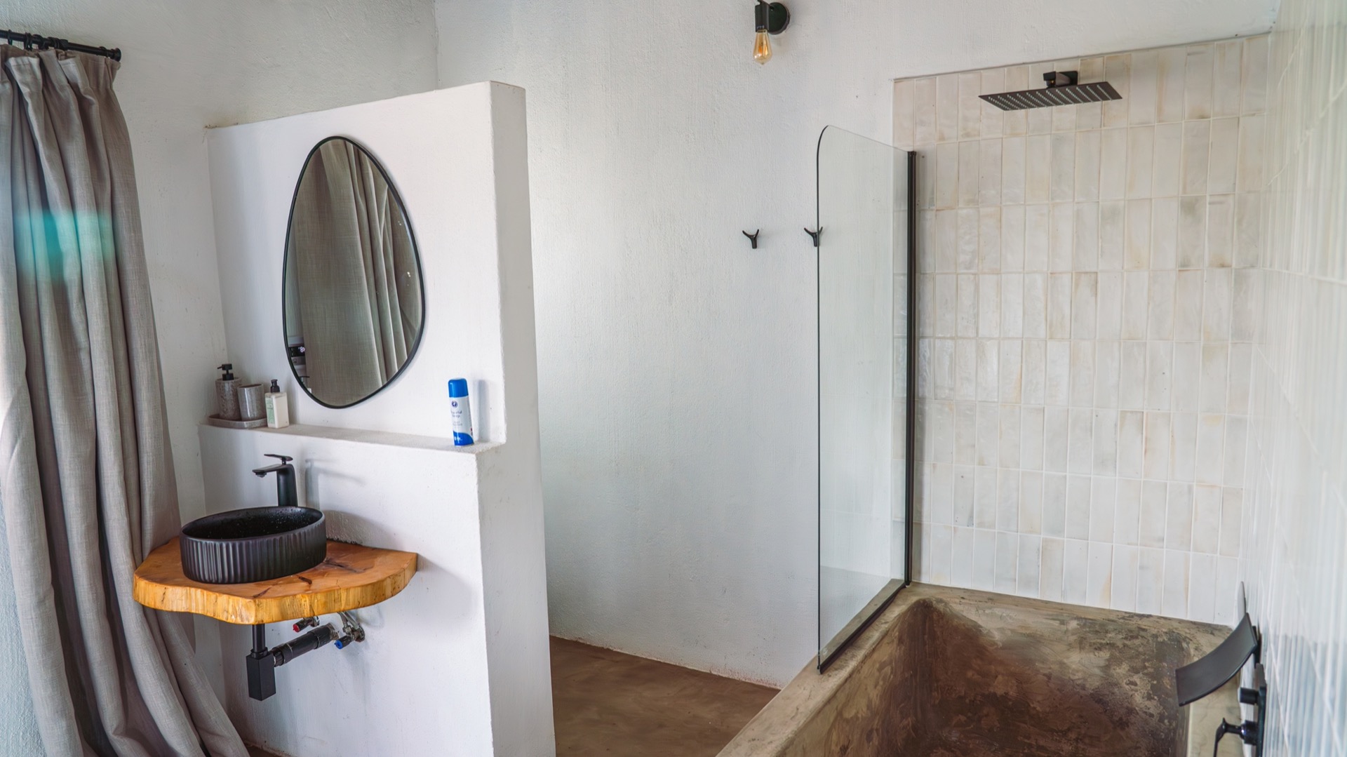 En-suite bathroom with a walk-in shower and a moulded stone tub